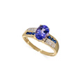 KatNr 890   Gelbgold-Ring mit zentralem Tansanit und Brillanten und Saphiren.